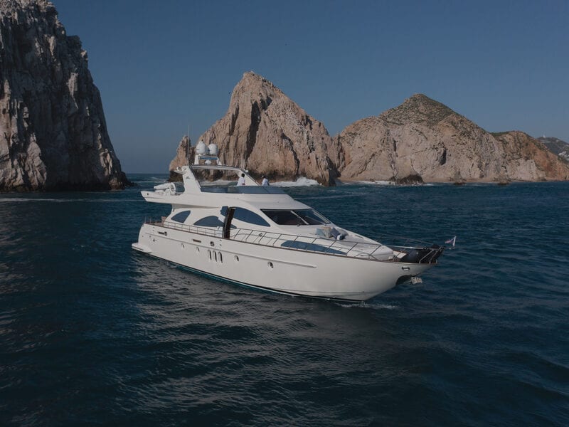 Heather Nikki 80 ft Sunseeker yacht cruising past the Cabo coastline